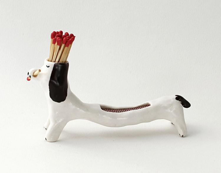 Matchstick Holding Dog - With Striker Area on Its Back