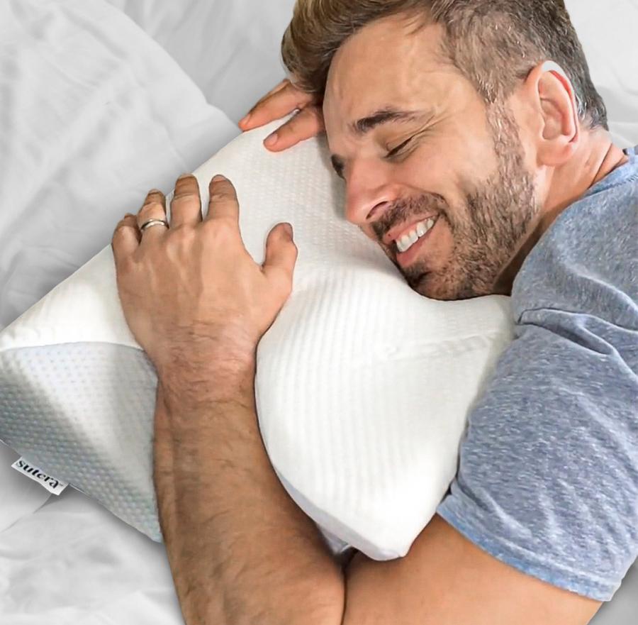 This Ergonomic Pillow Has Arm Slots Designed For Side And Stomach Sleepers