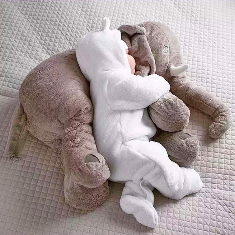 baby with stuffed elephant