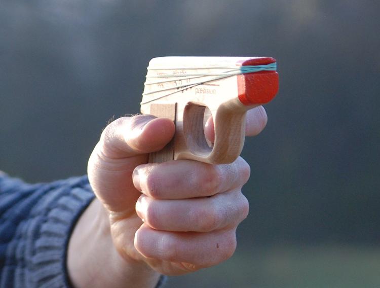 Elastic Precision: Semi-Automatic Rubber Band Hand Gun