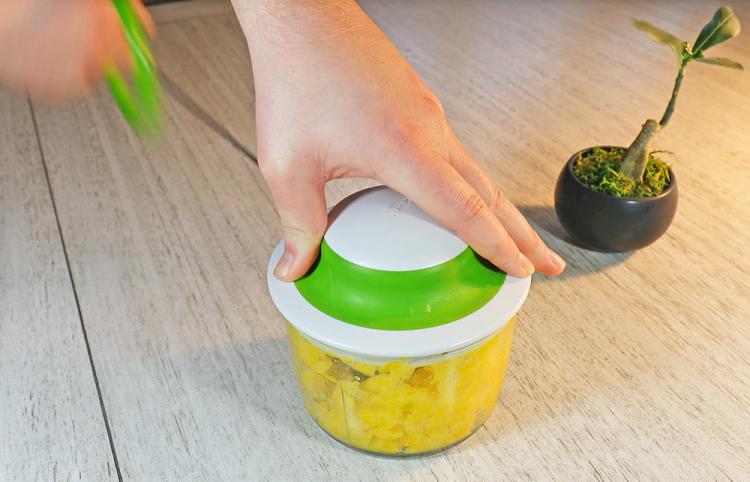 This hand-powered food chopper dices veggies easily at home or while camping