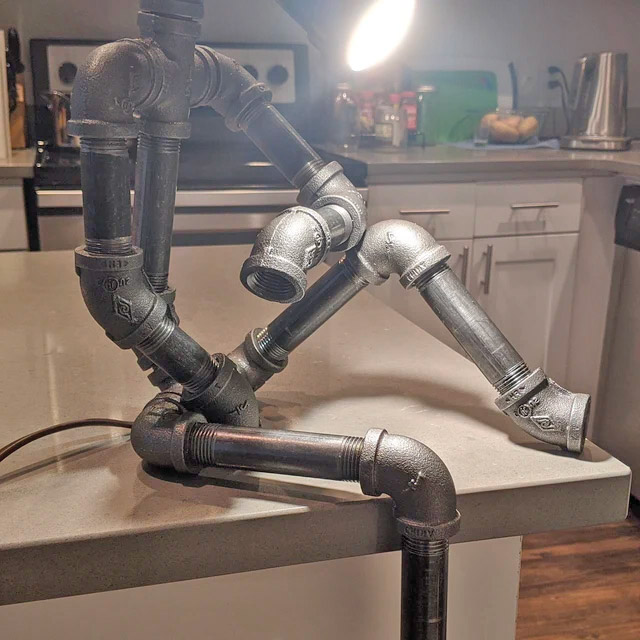 Sitting Pipe Robot Lamp - Industrial design thinking pipe man with lamp for head