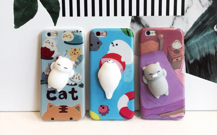 iPhone Cases Have Soft Squishy Cats On The Back of Them