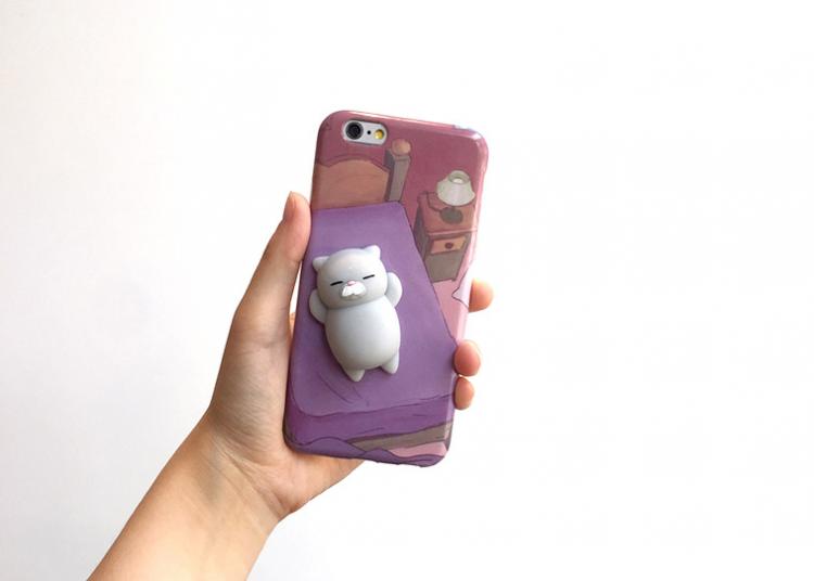 These iPhone Cases Have Soft Squishy Cats On The Back of Them