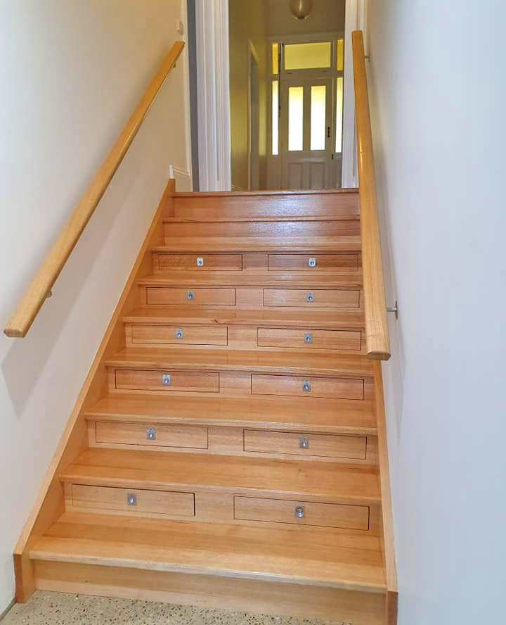 Builder Turned Their Staircase Into an Incredible Wine Cellar - Staircase wine storage drawers system