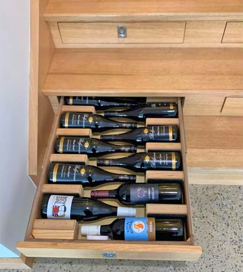 Builder Turned Their Staircase Into an Incredible Wine Cellar - Staircase wine storage drawers system