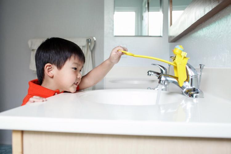 The Aqueduck Faucet Handle Extender Helps Kids Reach The Faucet