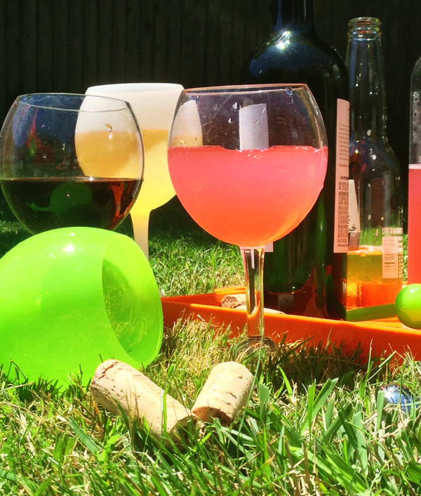 These genius wine glasses stick in the sand and float in the pool