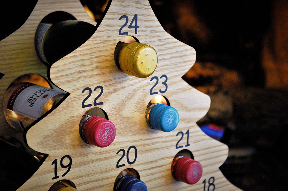 This Christmas Tree Advent Calendar Holds Mini Bottles Of Wine