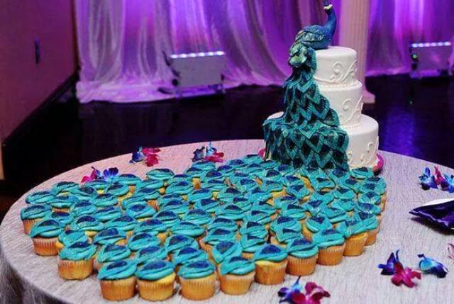 Peacock Wedding Cake - Creative three-layer peacock cake uses cupcakes for the tail of the bird