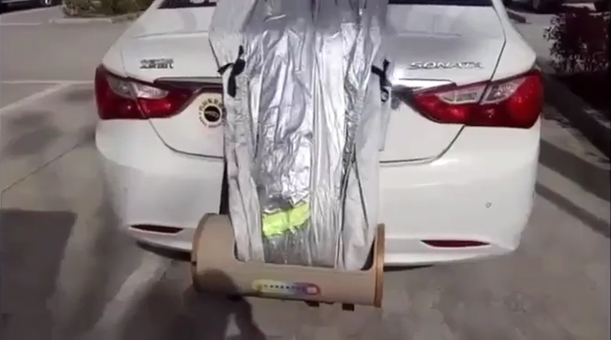 This Nifty Car Cover Automatically Retracts Itself, and Hides In Your Trunk