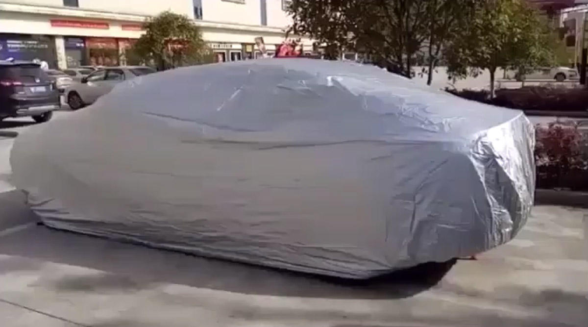 This Nifty Car Cover Automatically Retracts Itself, and Hides In Your Trunk