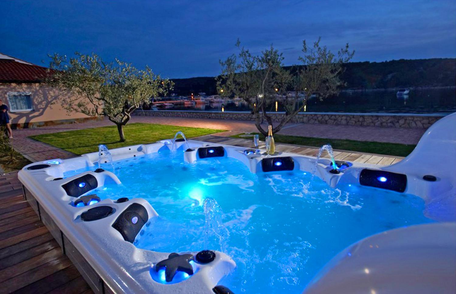 This Ultimate Hot Tub Has Two Tiers With an Attached Endless Swimming Pool