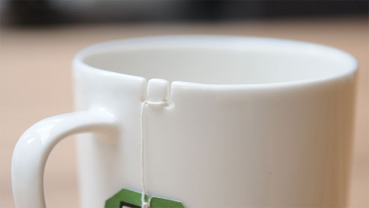 Tie Tea Cup - Wrap tea bag around notch in cup