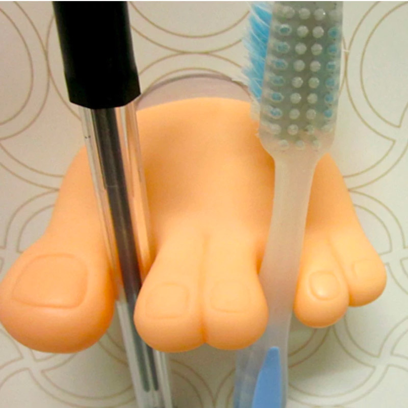 Toes and foot shaped toothbrush holder