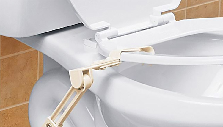 foot operated toilet seat lifter