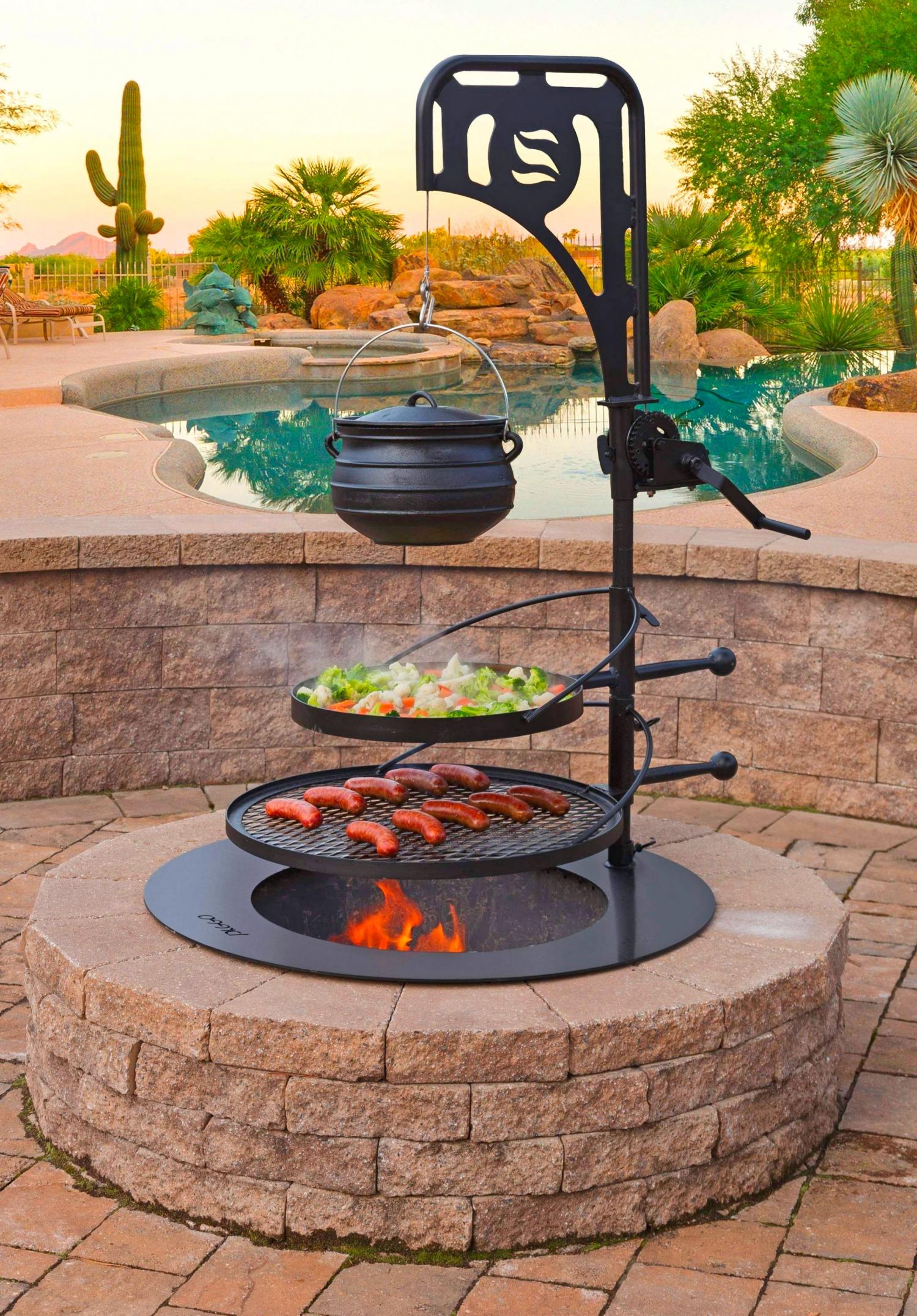 This Ultimate Fire Pit Has Tiered BBQ Grates and A Kettle Winch