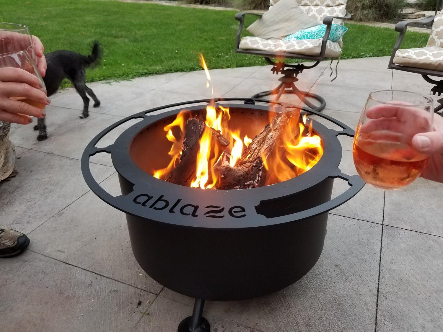 This Ultimate Fire Pit Has Tiered BBQ Grates and A Kettle Winch