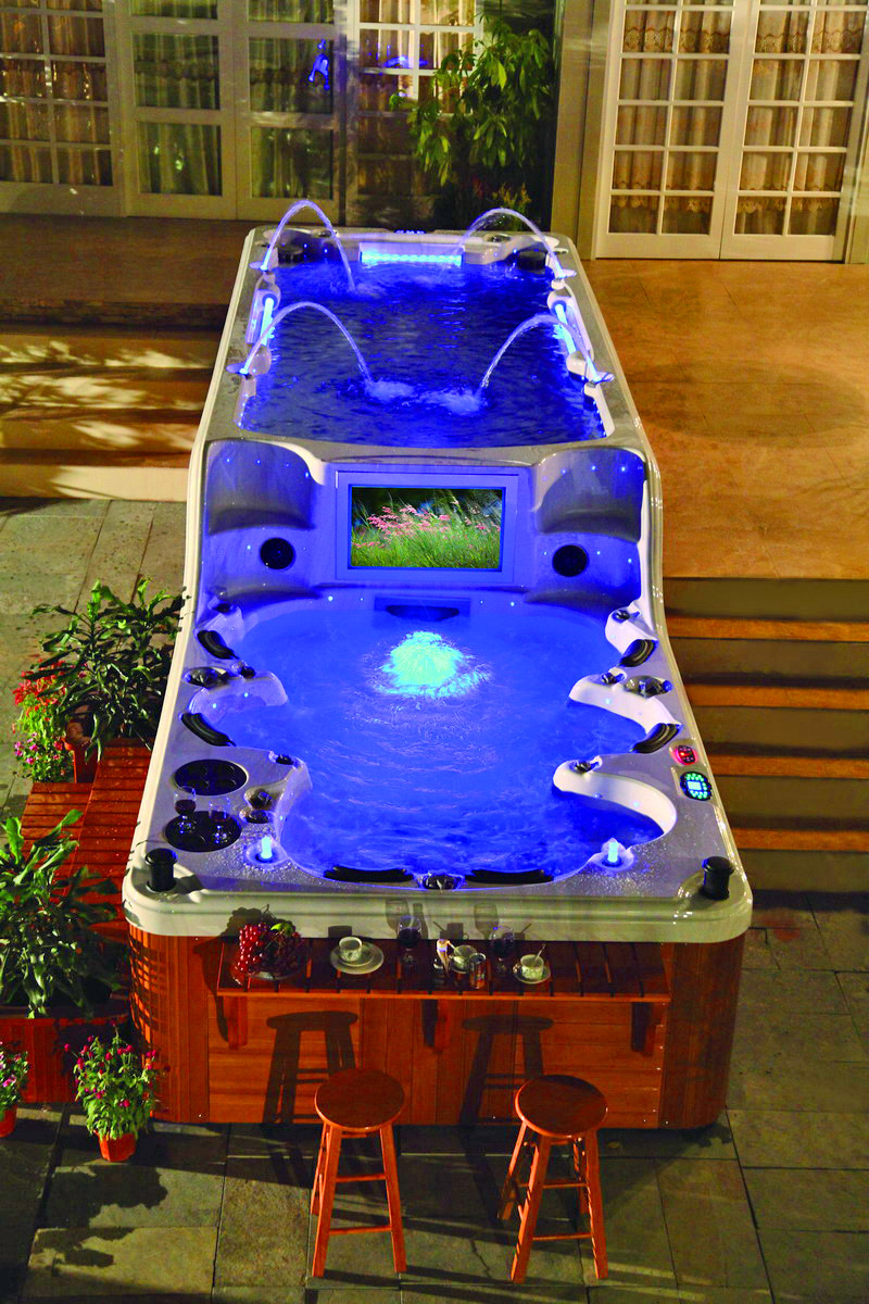 This Ultimate Hot Tub Has Two Tiers With an Attached Endless Swimming Pool