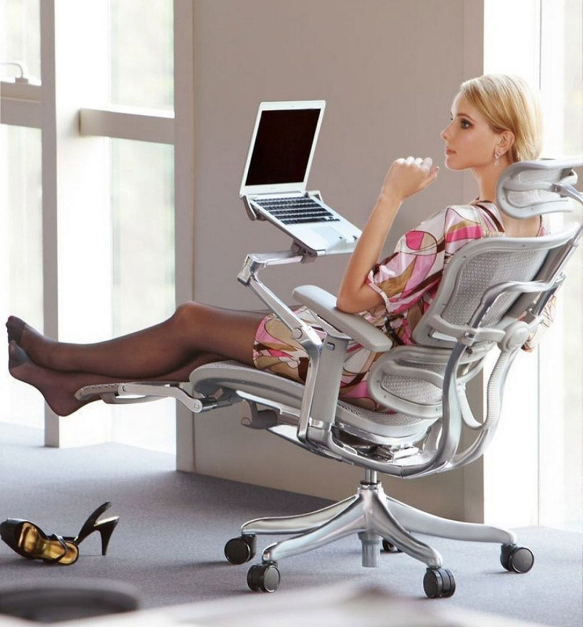 This Ultimate Office Chair Has a Laptop Mount, Leg Rests, and a Head Rest
