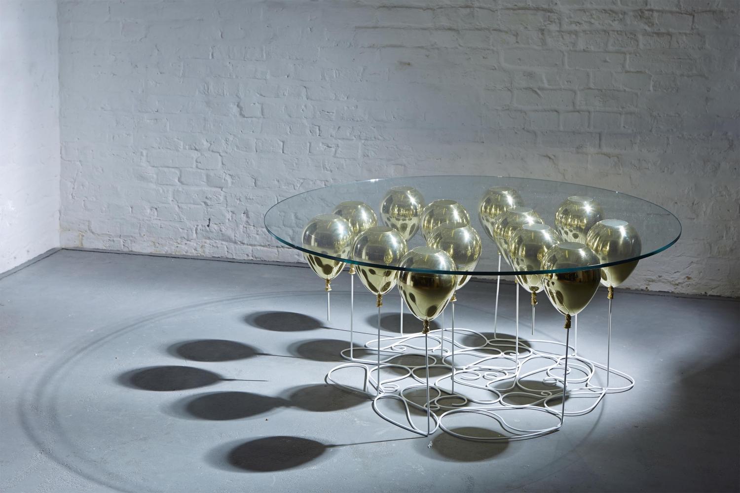 Up Balloon Table - Artsy table using balloons to hold up glass tabletop - Duffy London