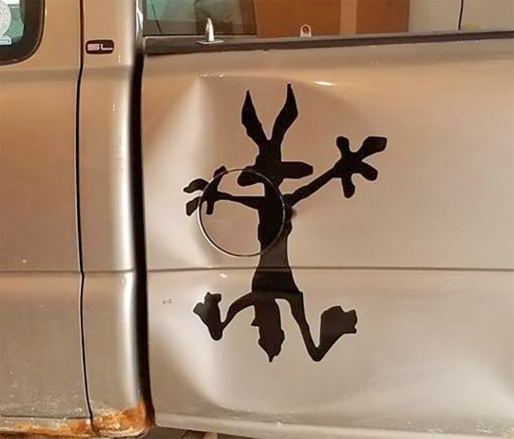 Wile-E Coyote Car Dent Vinyl Decal - Hidden car dent with wile-e coyote sticker