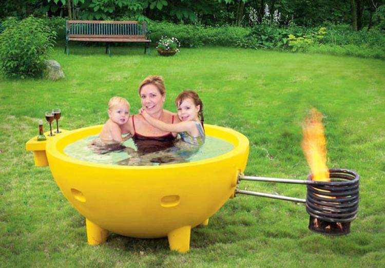 wood burning hot tub uses fire to heat water