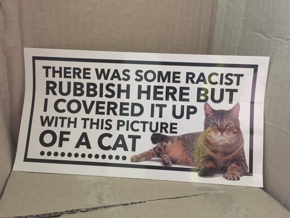 Giant Cat Sticker To Cover Up Racist Graffiti On The Streets - Manchester cat stickers
