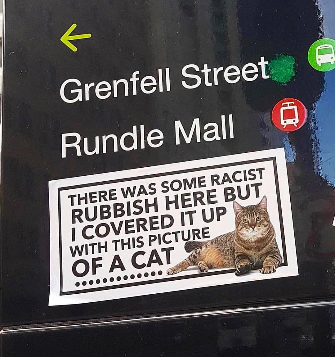 Giant Cat Sticker To Cover Up Racist Graffiti On The Streets - Manchester cat stickers