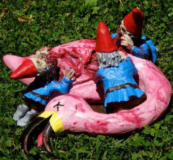 Zombie Gnomes Feasting On Flamingo