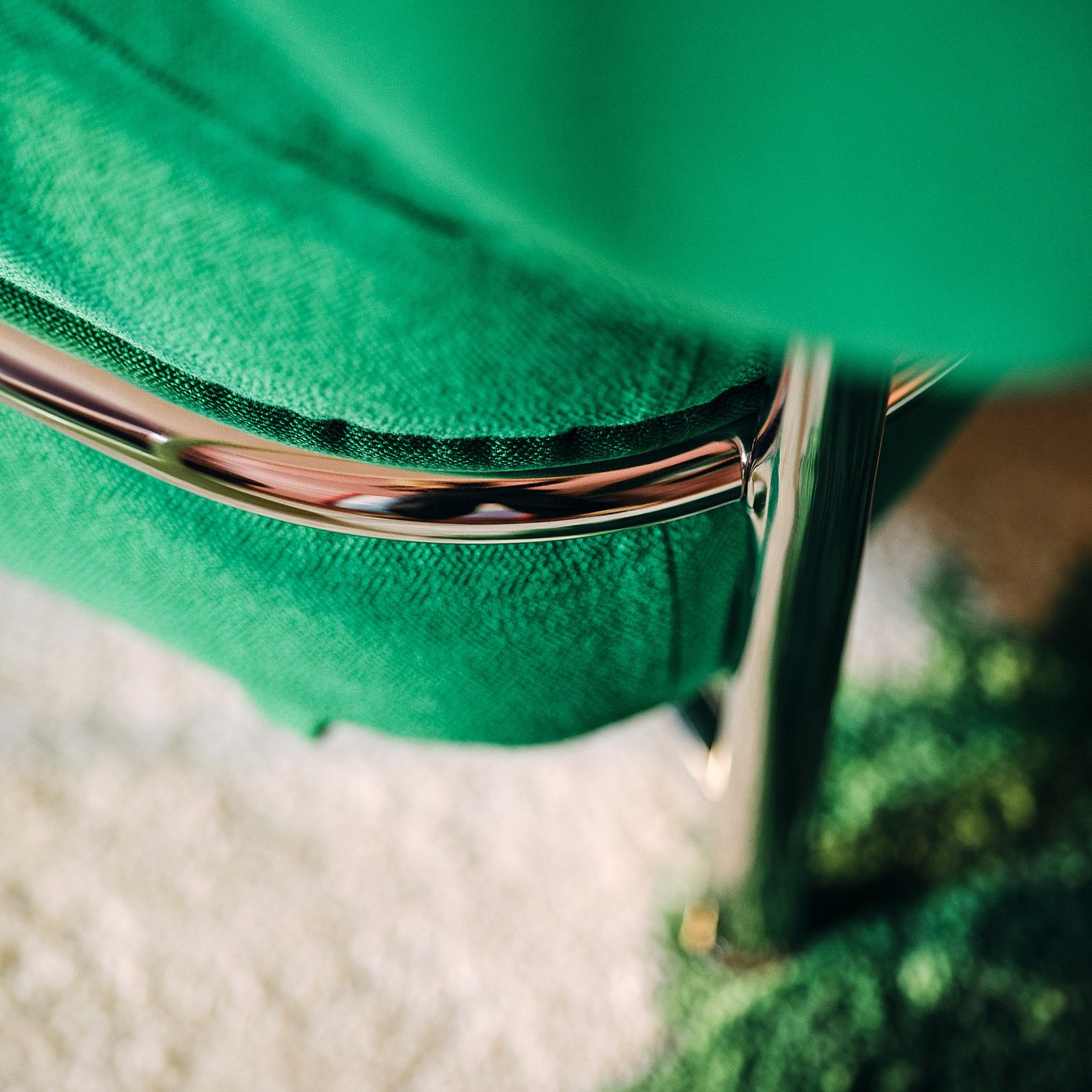 Chrome steel tube frame wrapping the green inflatable chair cushion