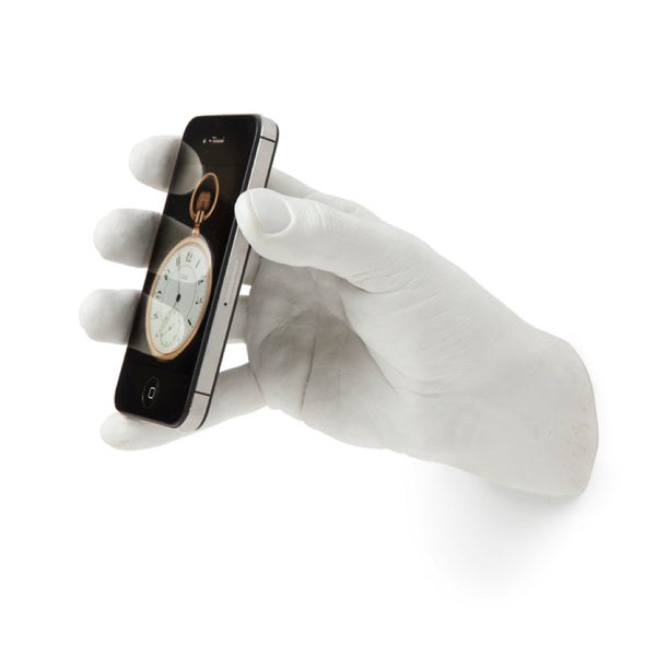 Areaware phone hand hook holding a smartphone