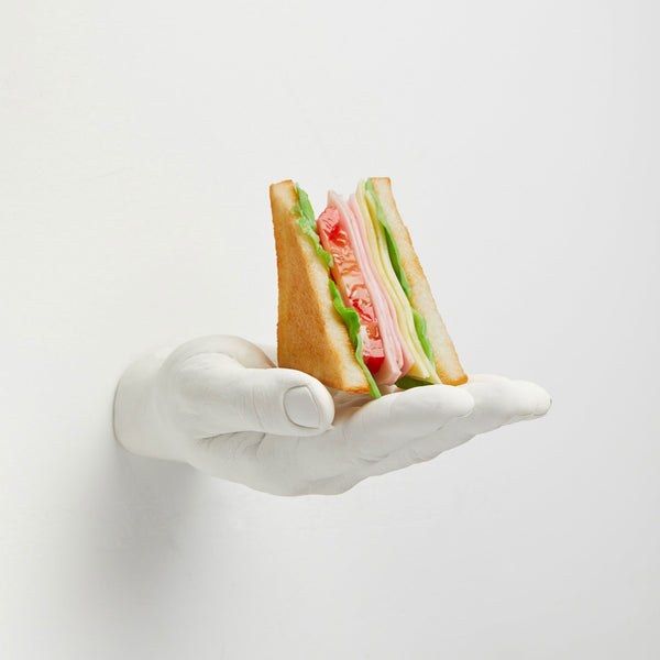 Areaware Offer Hand Hook holding a sandwich