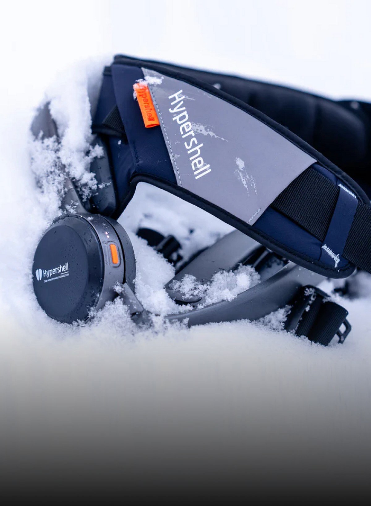 Hypershell exoskeleton module shown in snowy outdoor conditions