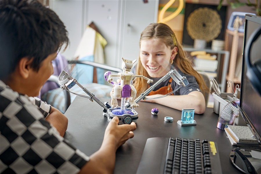 Child playing with a purple LEGO Pokemon SMART Play scene