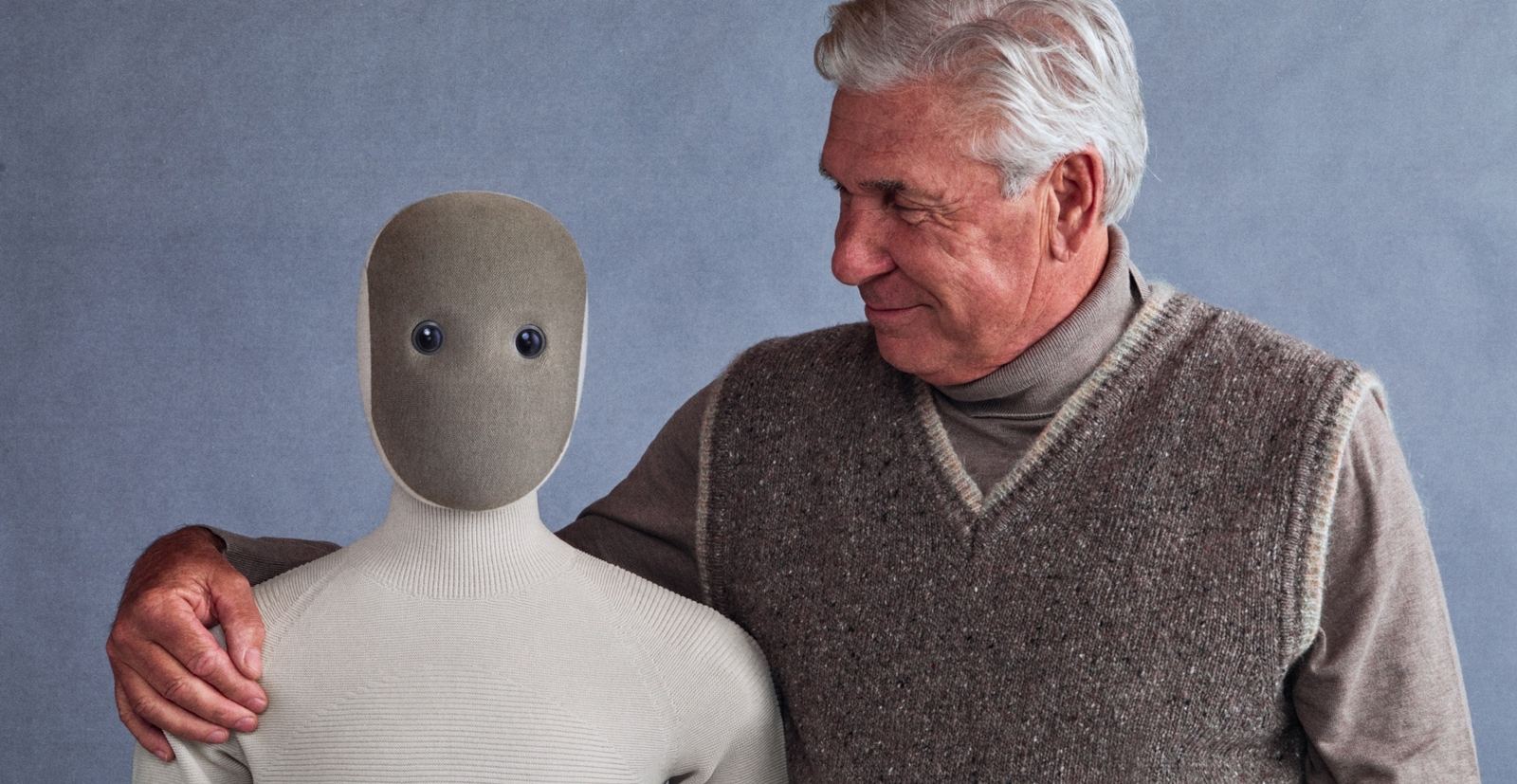 NEO humanoid home robot standing next to a person