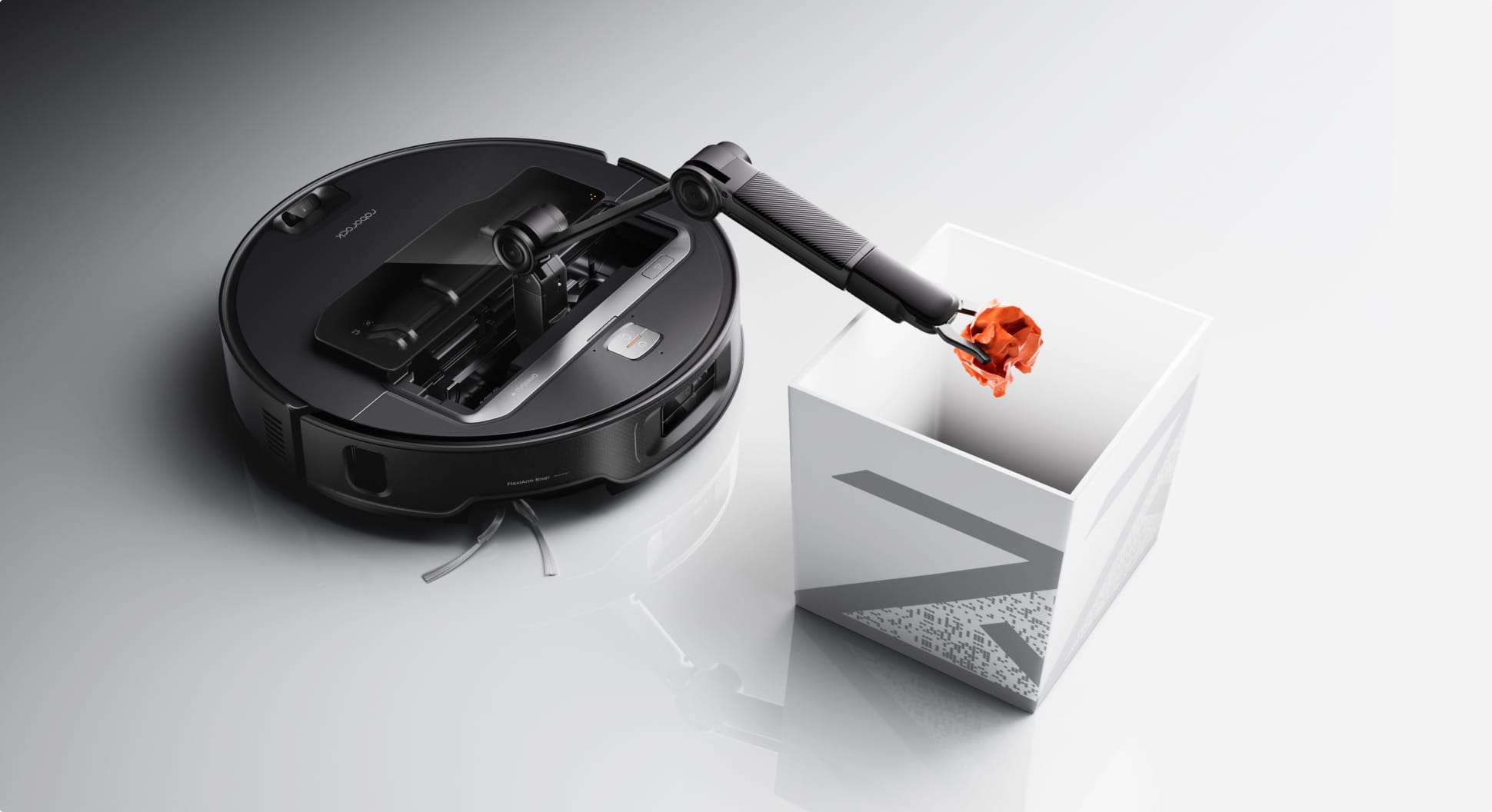 Roborock Saros Z70 robot vacuum arm placing a crumpled tissue in a storage box
