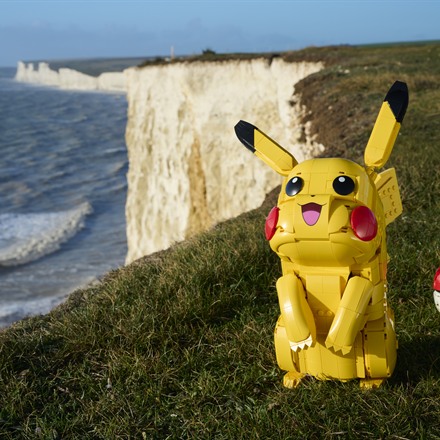 Brick-built yellow Pokemon figure made from toy bricks outdoors