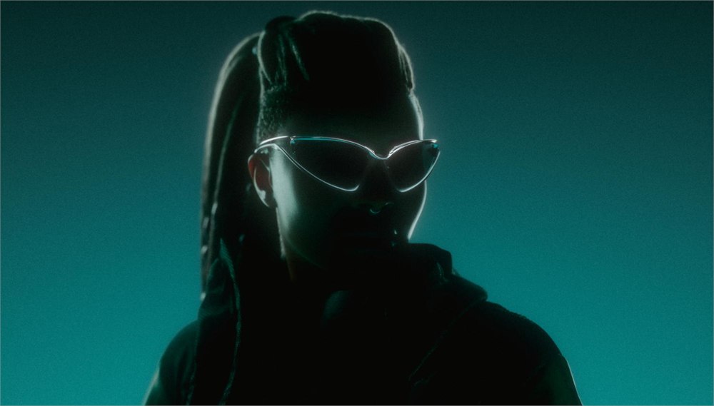 Model wearing Oakley Infiniloop sunglasses in the official launch portrait