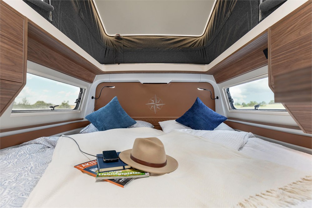 Westfalia Columbus Liner king bed beneath the large roof window