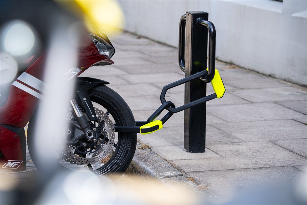 Hiplok L1000 LINK securing a motorcycle to street furniture