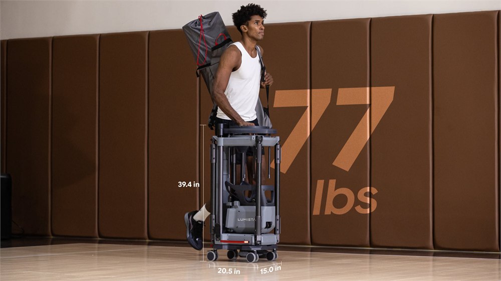 Player moving the 77 pound LUMISTAR CARRY basketball trainer
