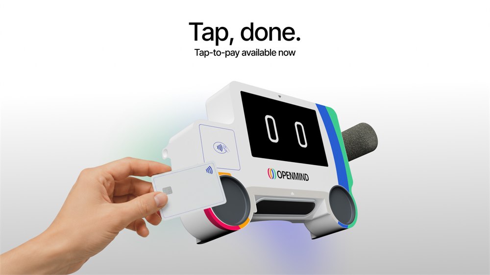 OpenMind robot head demonstrating tap-to-pay capability