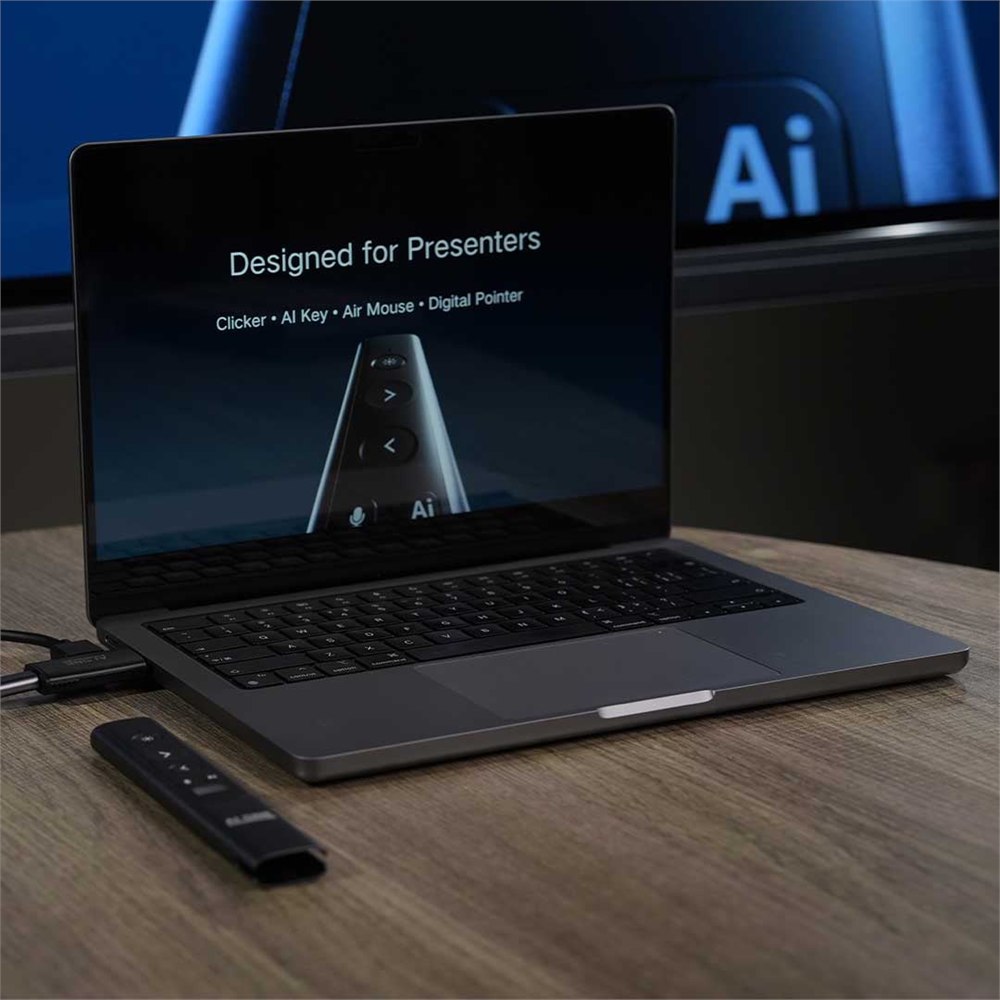 PowerRider P1 presenter remote beside a laptop presentation setup