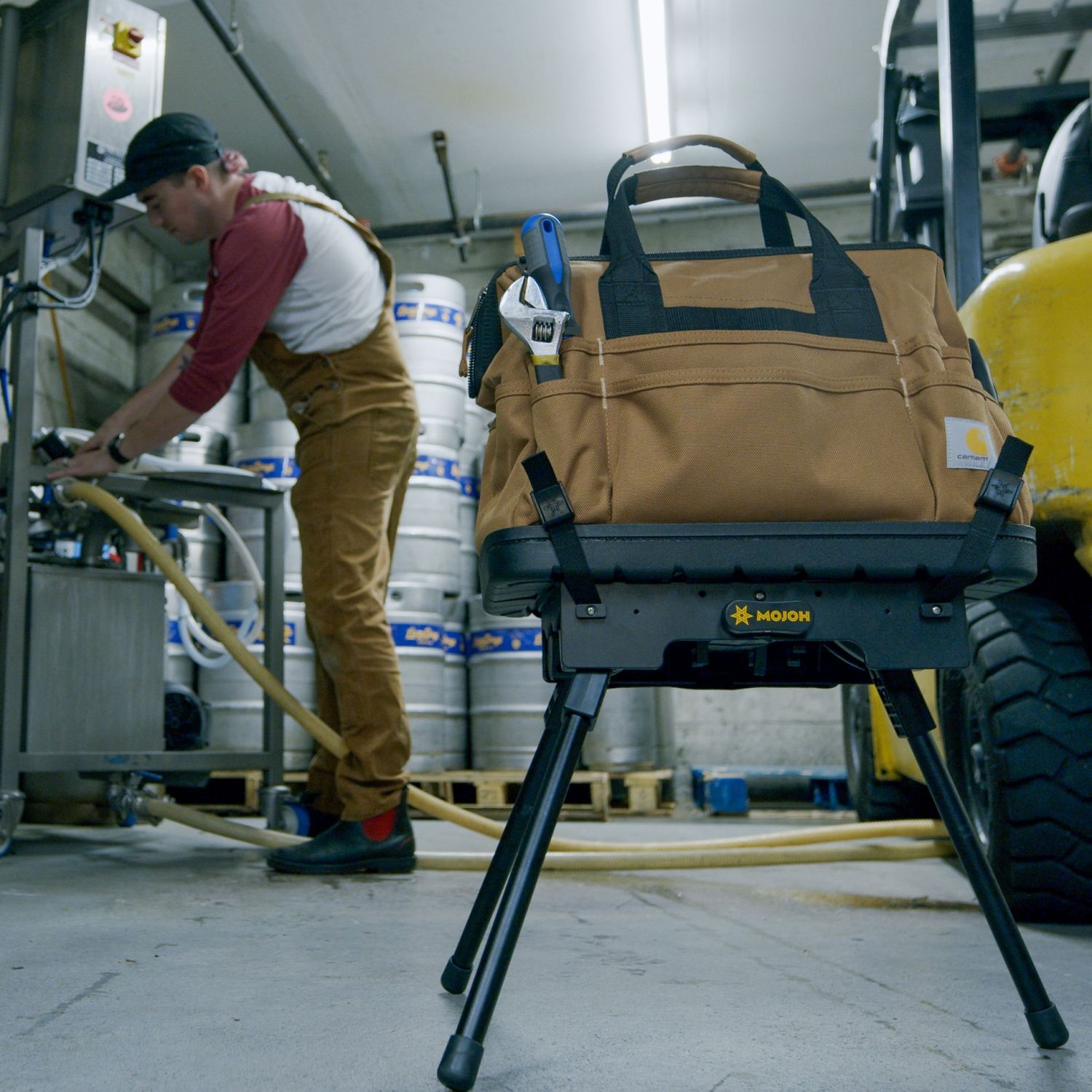 Mojoh Ryzer Go supporting a tool bag on a workshop floor