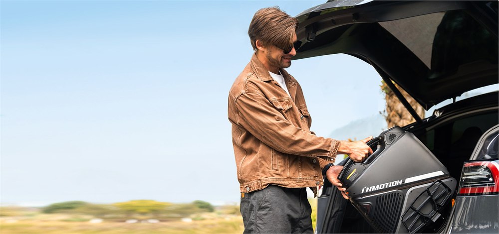 INMOTION V9 being loaded from a car trunk