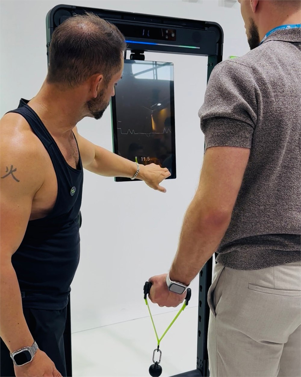 The OMNI X1 cable handles being demonstrated during a workout