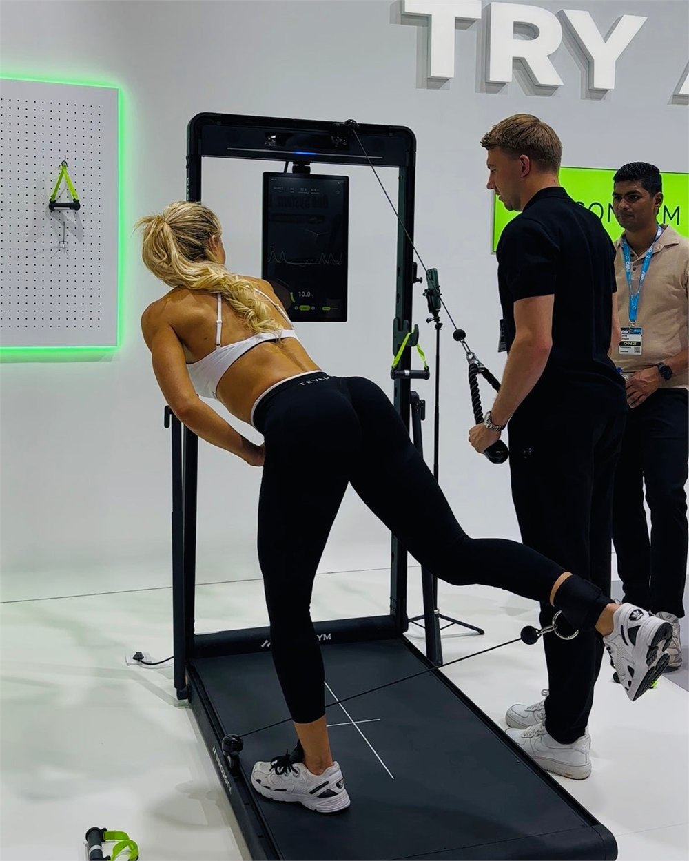 The OMNI X1 smart gym used for lower-body cable training