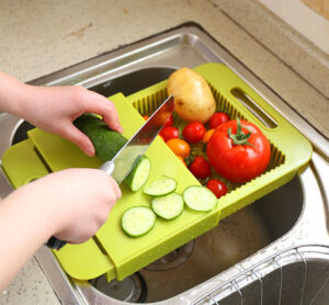 This 3-in-1 Over-The-Sink Cutting Board Lets You Clean, Chop, and Collect
