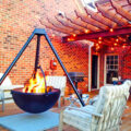 This Hanging Tripod Fire Pit Might Be The Manliest Way To BBQ Or Have a Bonfire